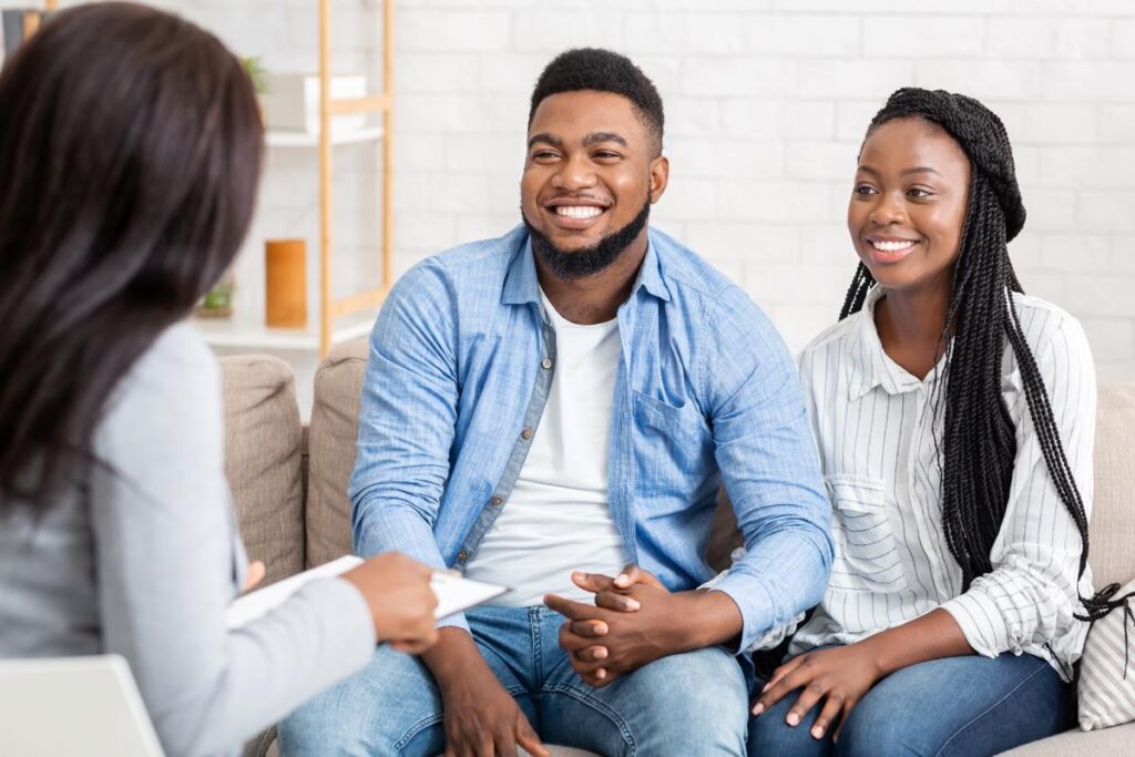 two people in family counseling talk to a therapist