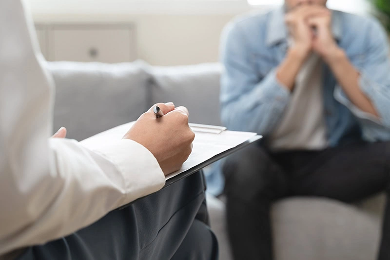 A person participates in addiction treatment.